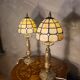 pair of bedside lamps in gilded bronze with glass shade