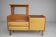 Vintage buffet/commode from the 50s-60s – Wood and mustard faux leather fronts.