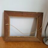 Frame with channels in wood and gilded stucco