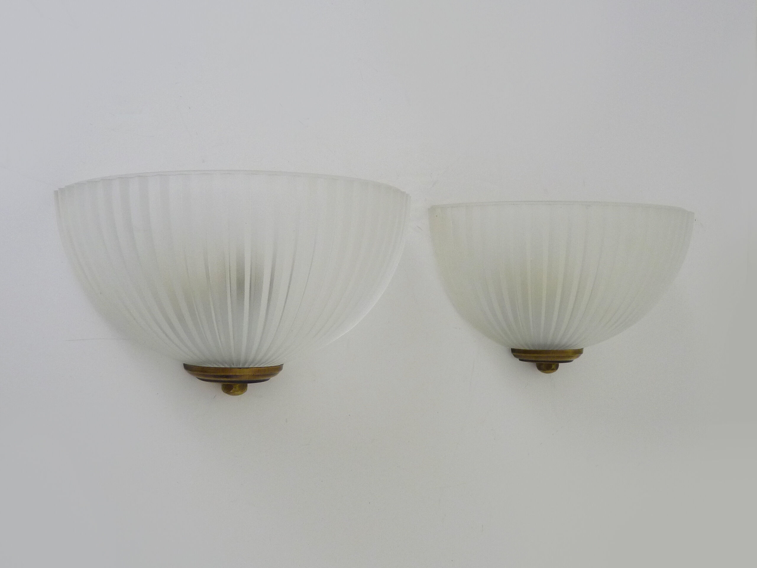 Pair of Mathias wall lamps in gilded metal and white shell-style glass