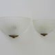 Pair of Mathias wall lamps in gilded metal and white shell-style glass