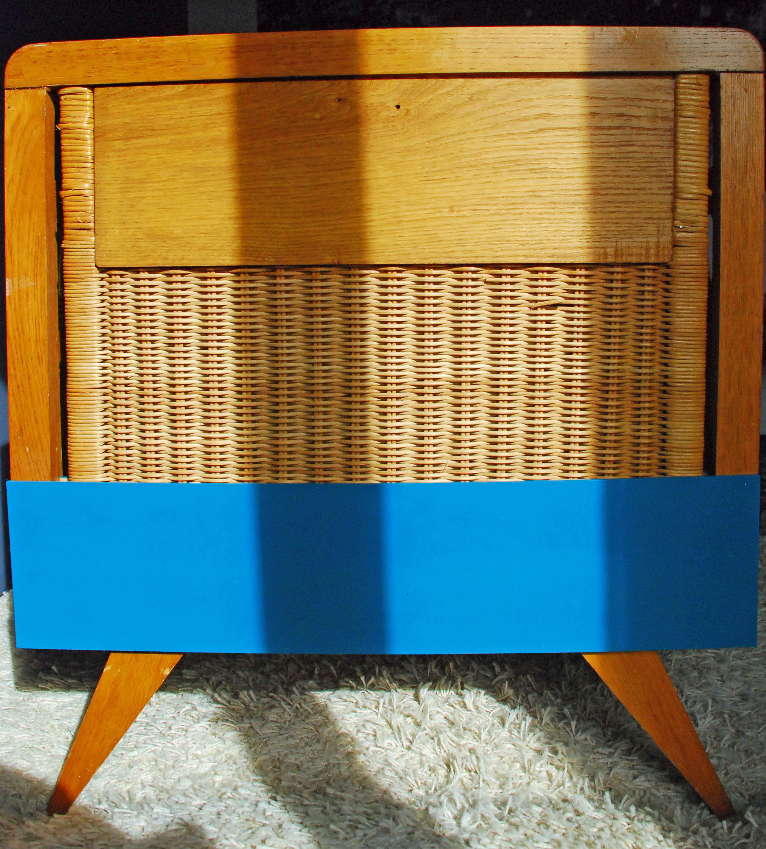Wooden bed and vintage rattan