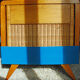 Wooden bed and vintage rattan