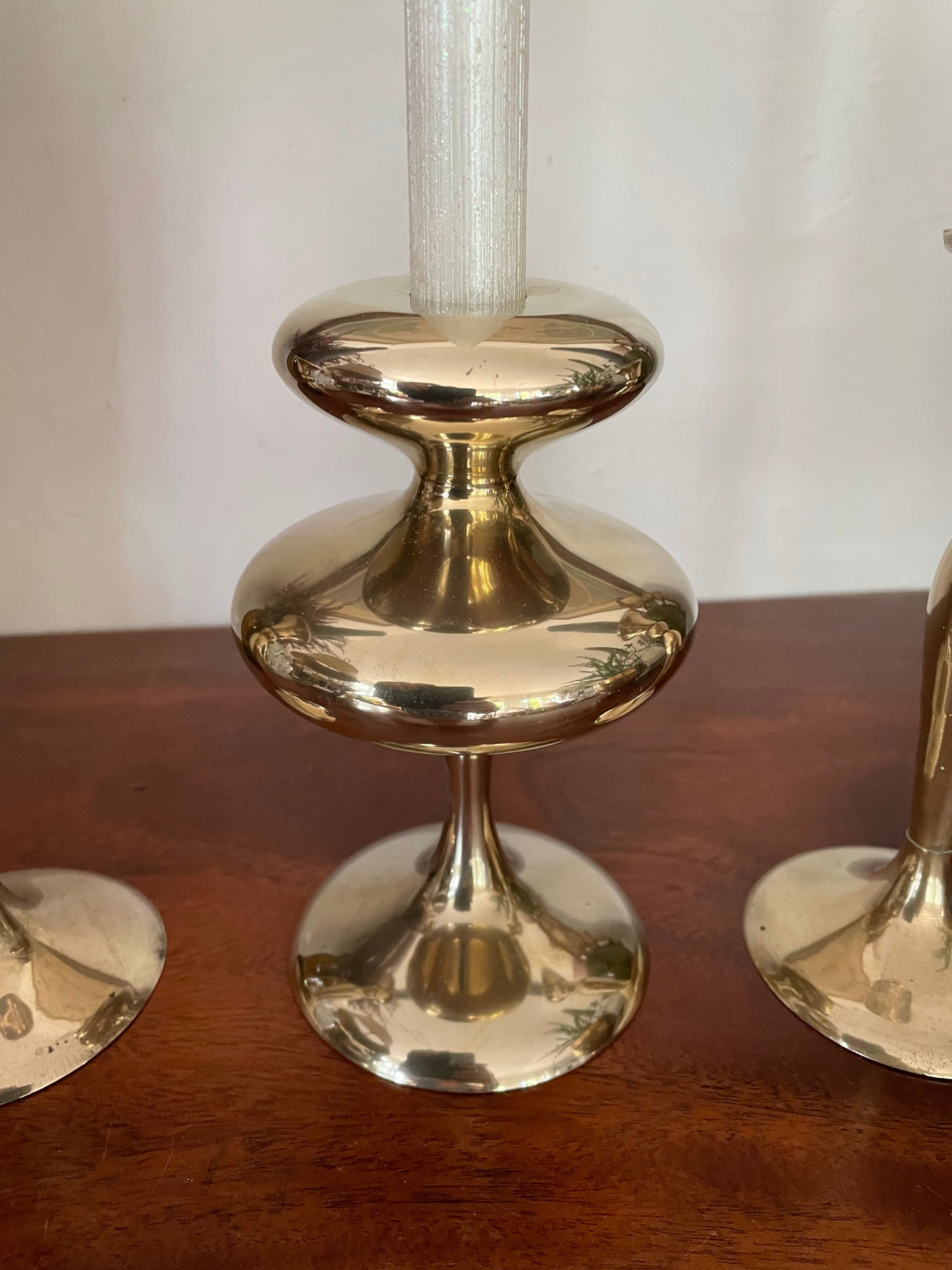 Three vintage brass candle holders