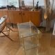 Elegant wheeled serving trolley in gilded brass and glass, in a spirit