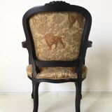 Black baroque armchair with fabric designed by wildlife by Ascension Latorre, Spain