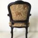Black baroque armchair with fabric designed by wildlife by Ascension Latorre, Spain