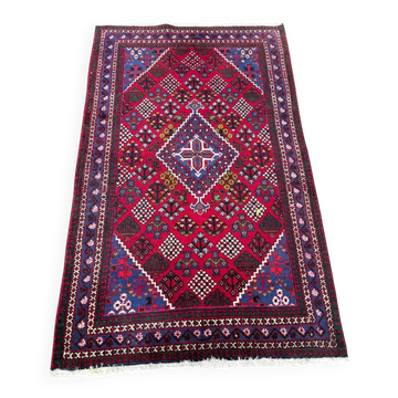 Authentic Persian carpet from Iran, hand-knotted in burgundy wool, 130x210cm.