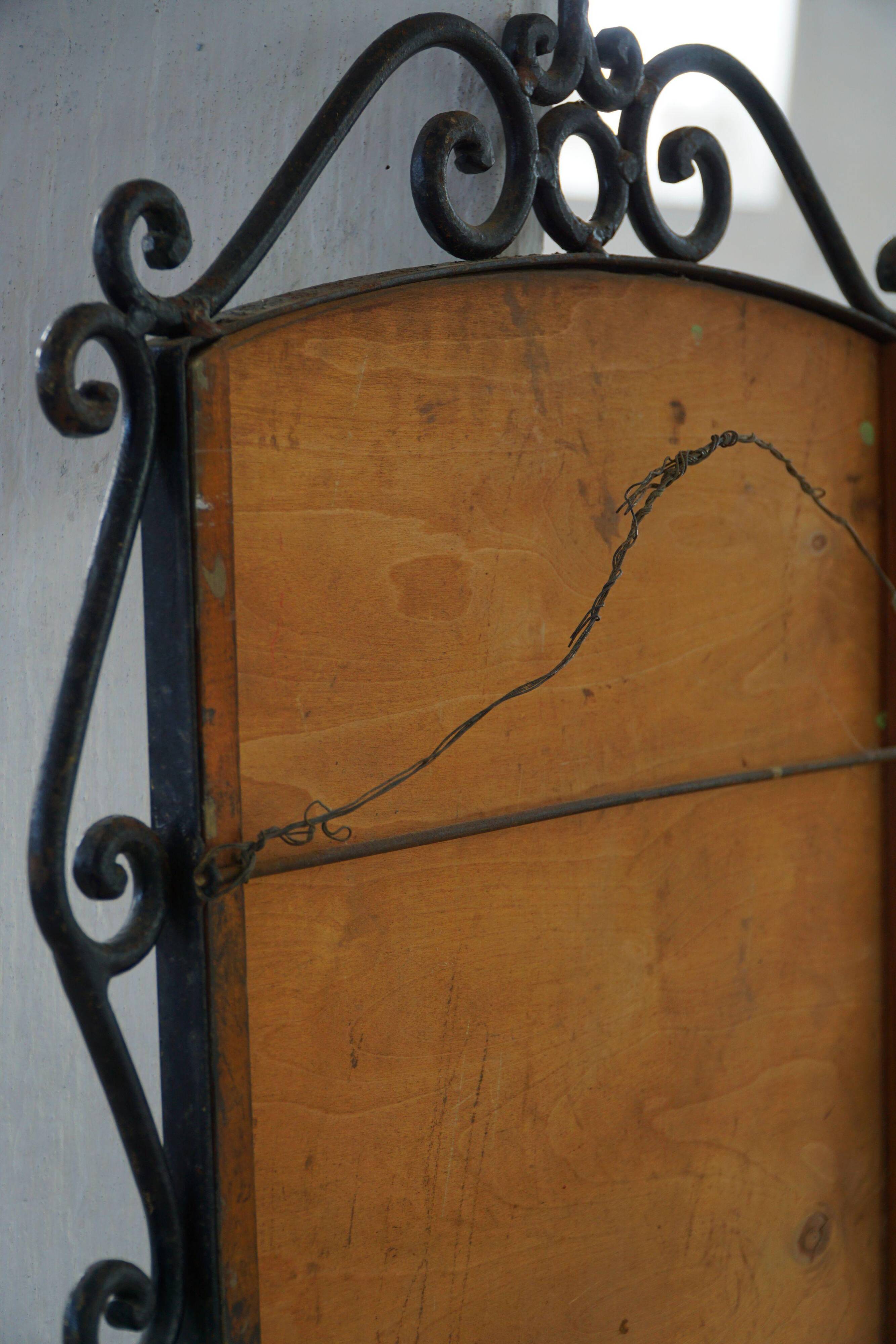 French mid-century brutalist wall mirror in wrought iron, made in the 1950s.