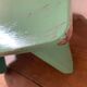 Vintage wooden footrest in mint green.