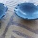 2 ceramic dishes decorated with fish (cups)