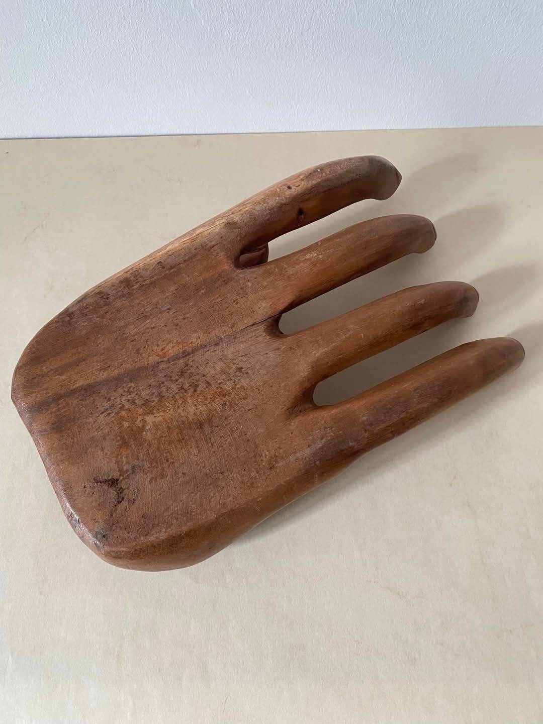 Wooden hand-held pocket emptier