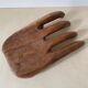 Wooden hand-held pocket emptier