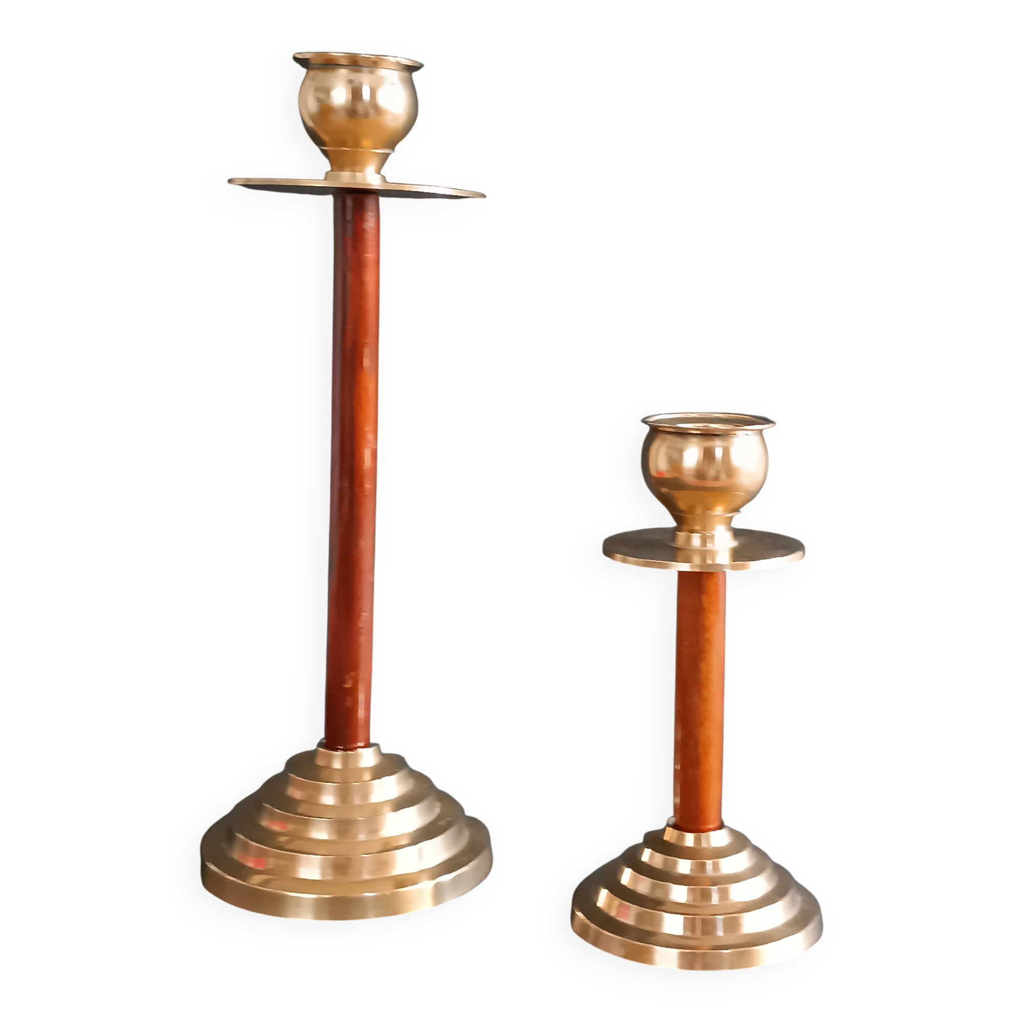 Two vintage wooden and brass candlesticks.