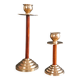 Two vintage wooden and brass candlesticks.