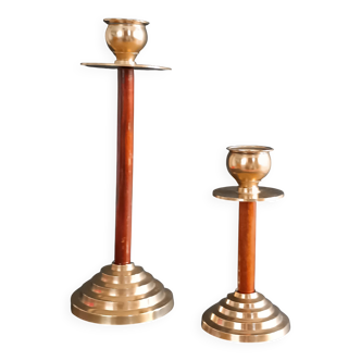 Two vintage wooden and brass candlesticks.