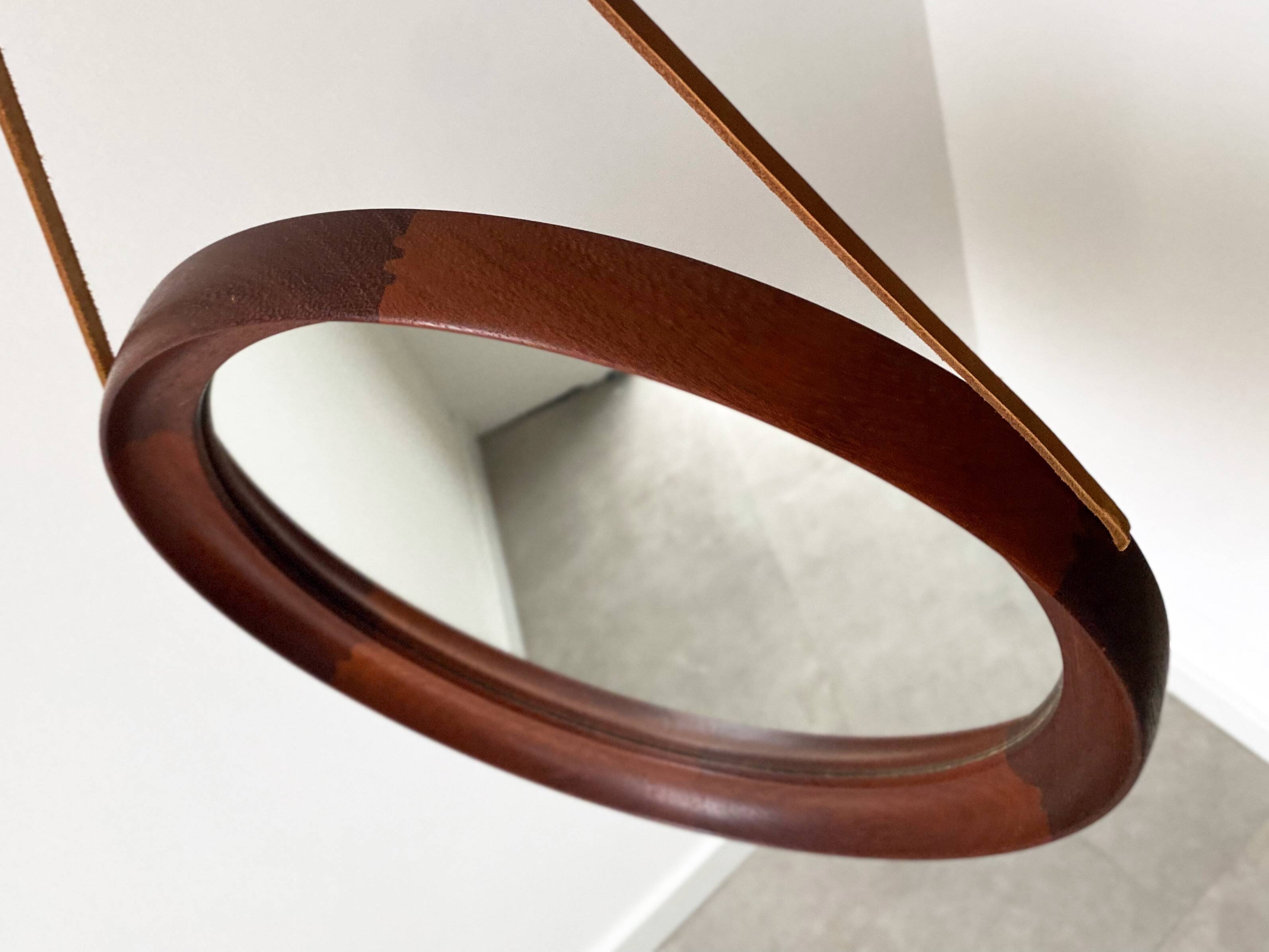Mid Century solid teak wall mirror with a leather strap - Danish design