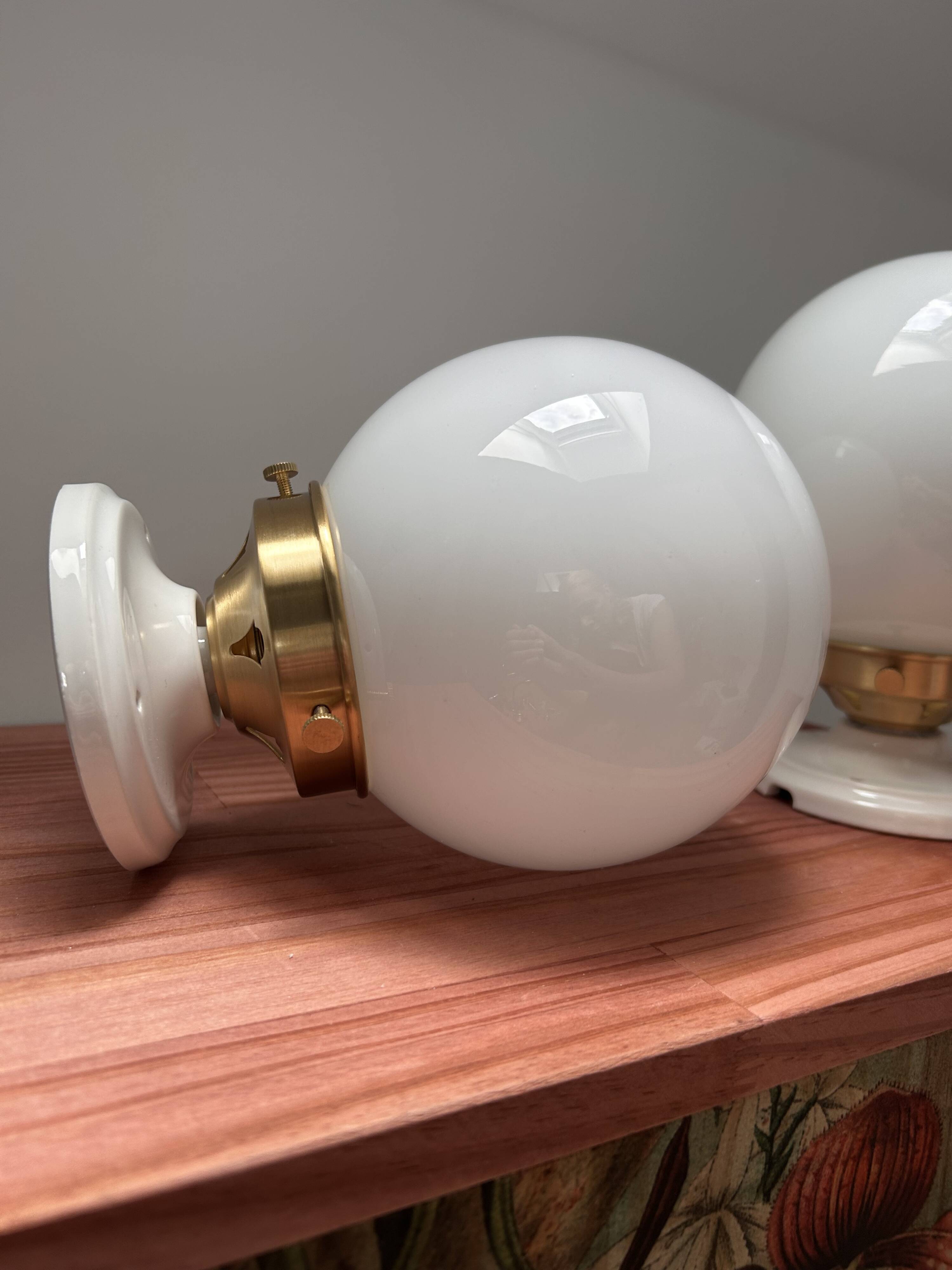 Set of two white opaline ball wall lights