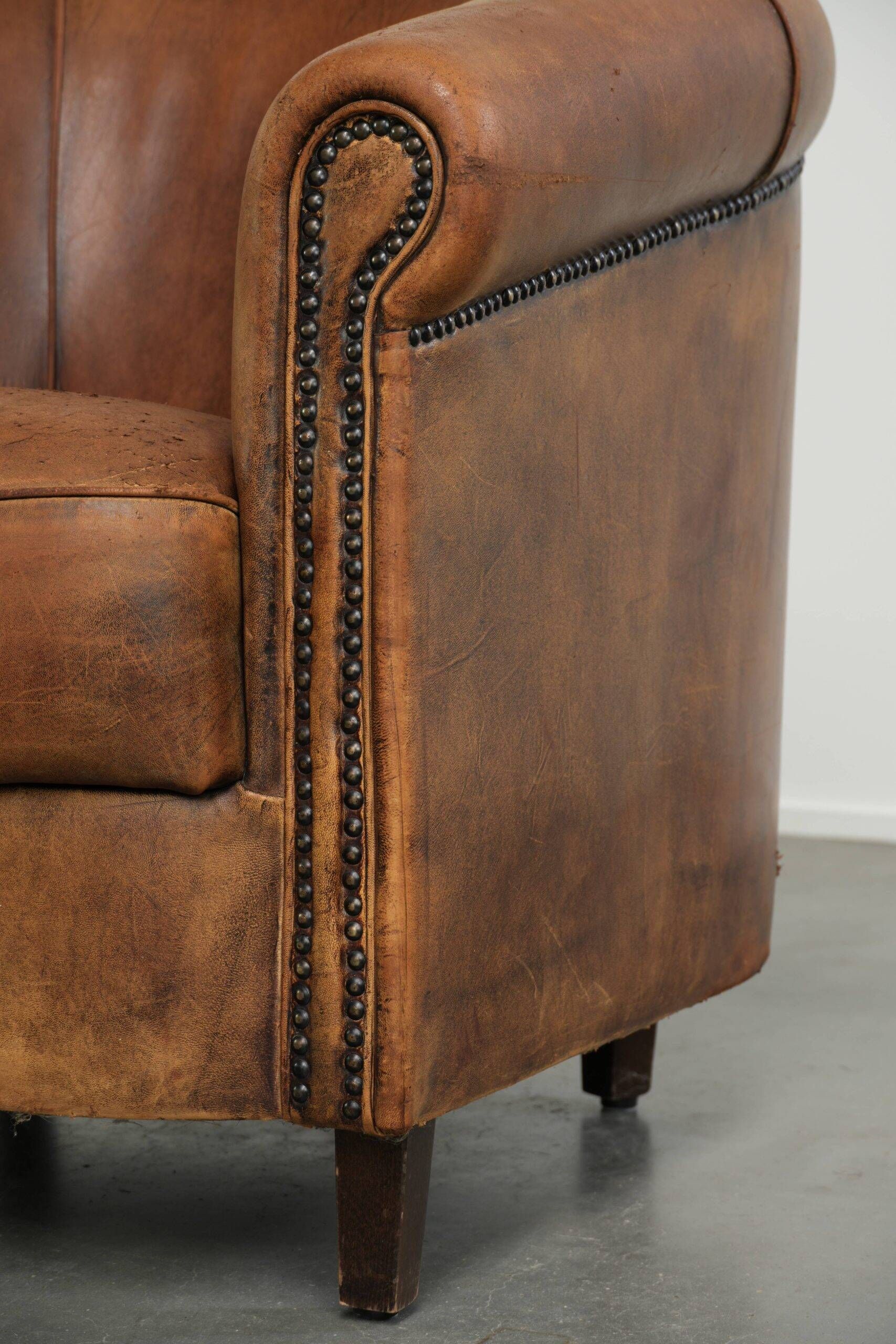 Sturdy set of vintage sheepskin club armchairs with a great appearance