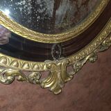 Miroir ovale en bois doré