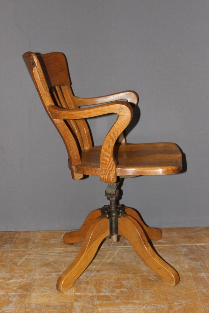 Rotating oak office chair circa 1930