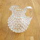Small pitcher with raised pimples