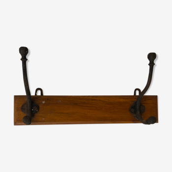 Wooden coat rack with metal hooks