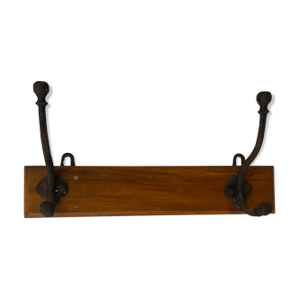 Wooden coat rack with metal hooks