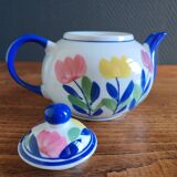 Antique teapot with flower pattern