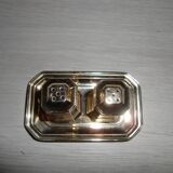 Silver-plated salt and pepper shakers presented on a small tray