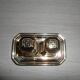Silver-plated salt and pepper shakers presented on a small tray