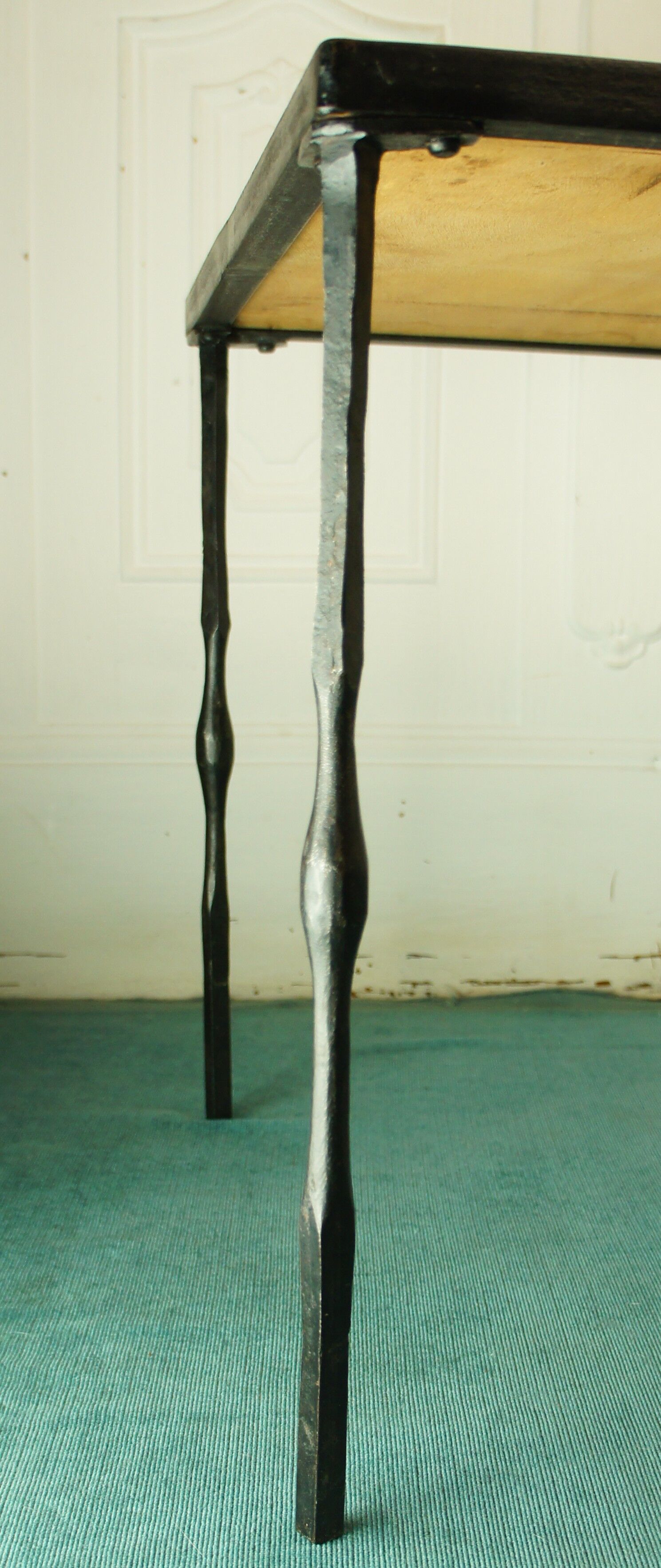 Signed black steel-ceramic side table