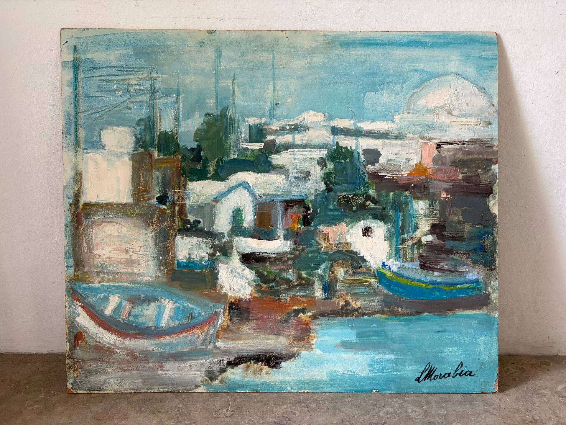 Village by the water, oil on panel signed Morabia.
