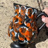 Red orange enamelled pitcher