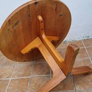 Scandinavian coffee table in solid pine with tripod legs in Swedish chalet style.