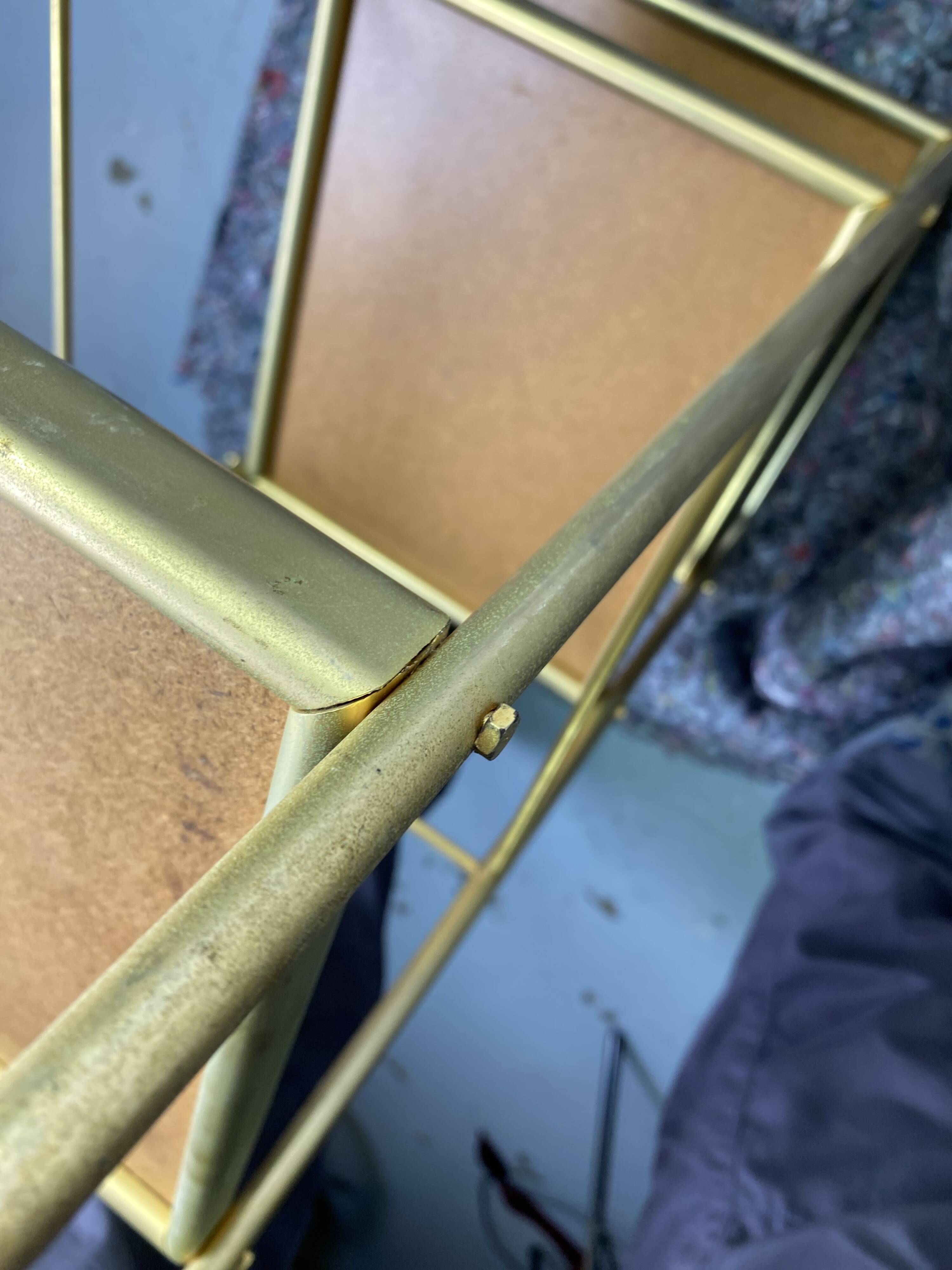 Small rolling trolley in brass and black plastic