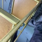Small rolling trolley in brass and black plastic