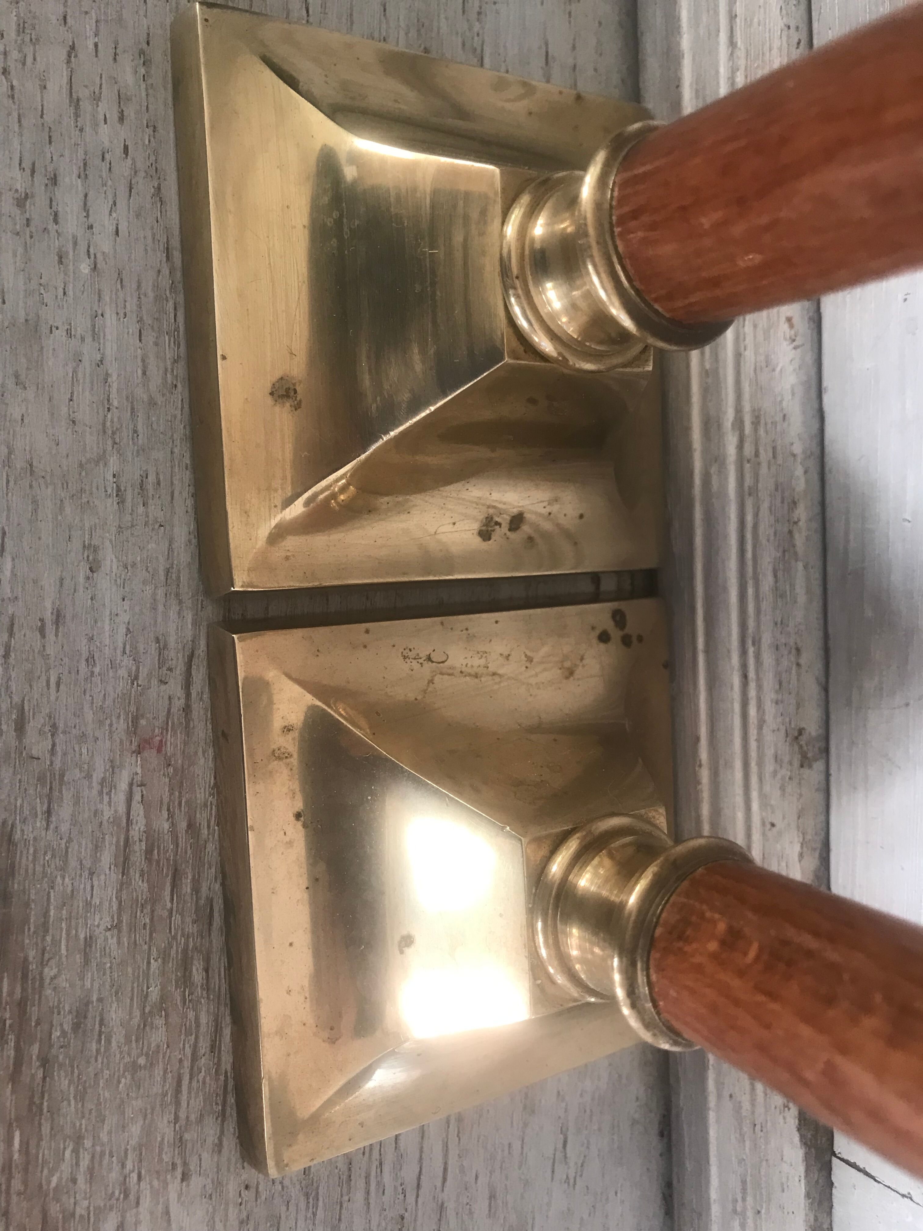 Pair of wood and brass candle holders