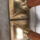 Pair of wood and brass candle holders
