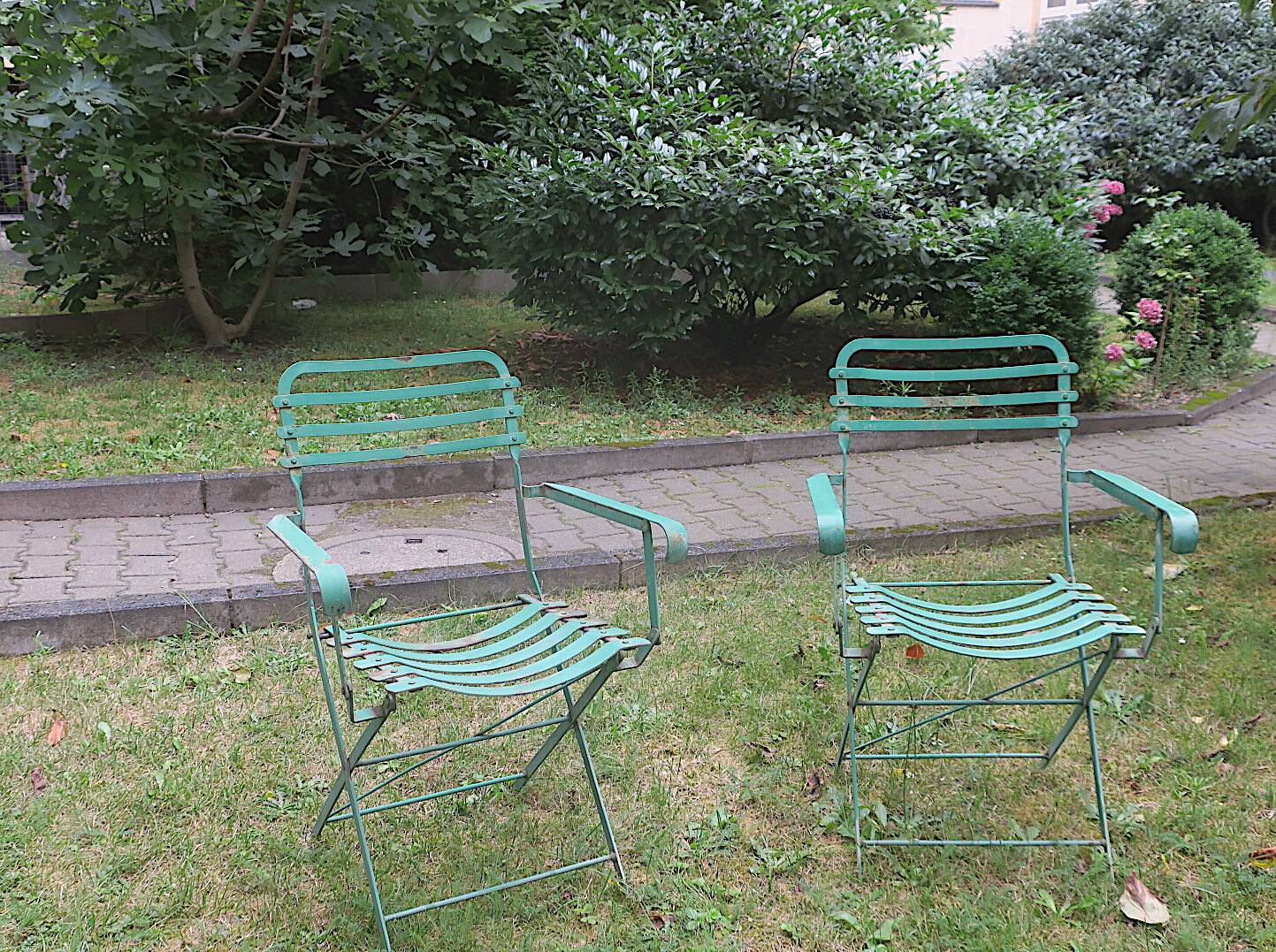 Pair of mid century distressed painted iron garden chairs