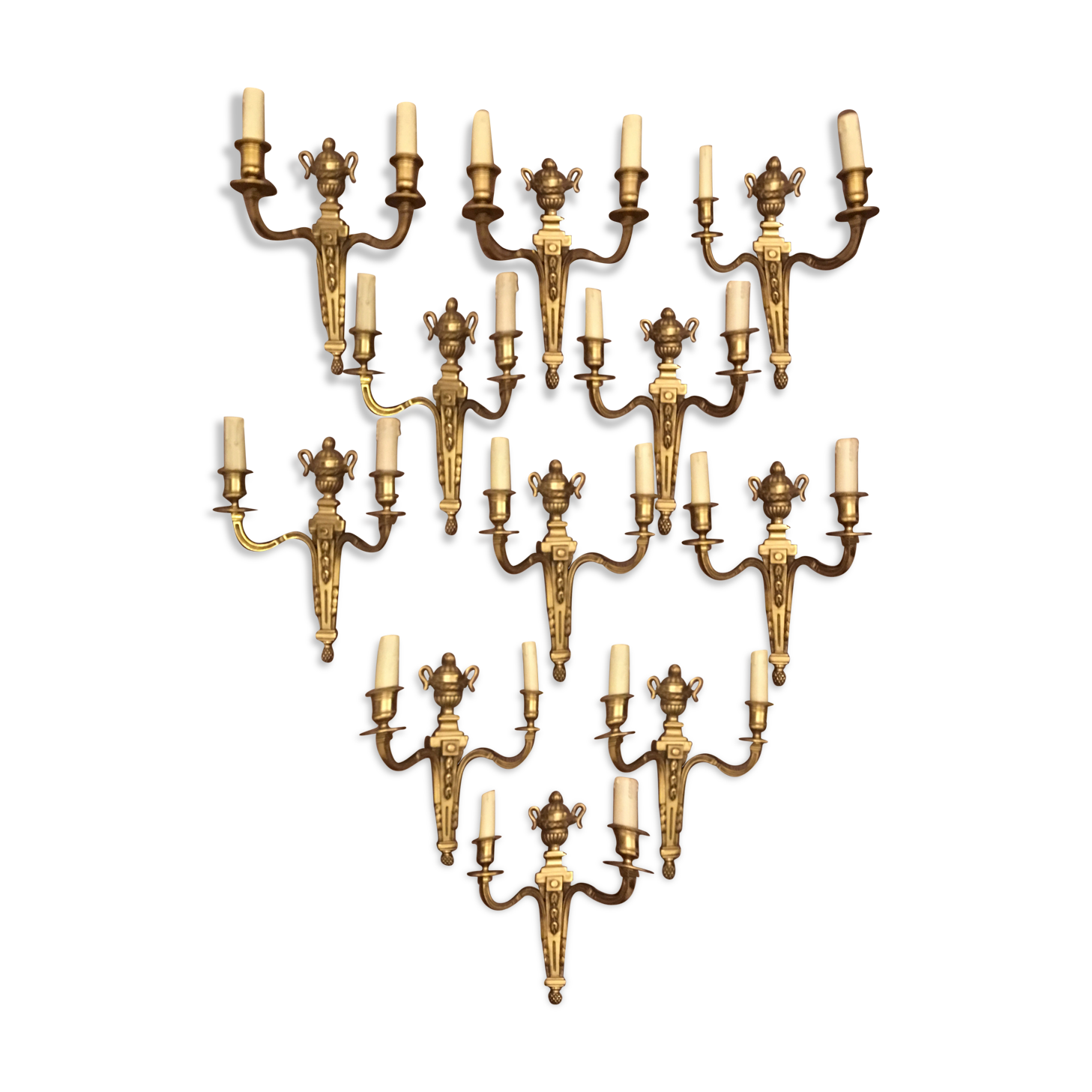 Eleven gilded bronze wall lamps