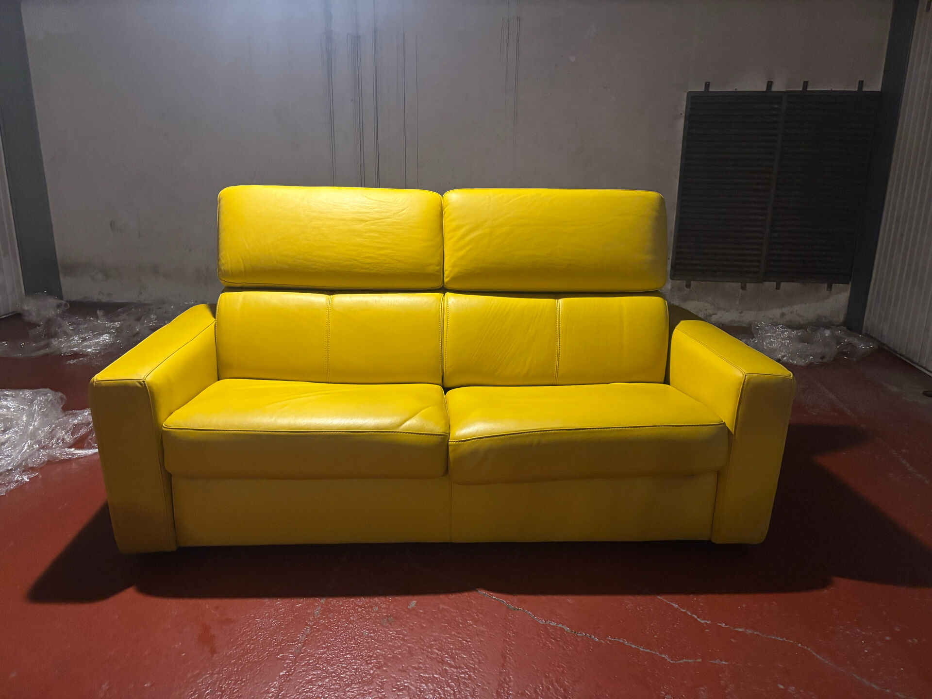 Yellow leather convertible sofa made in Italy.