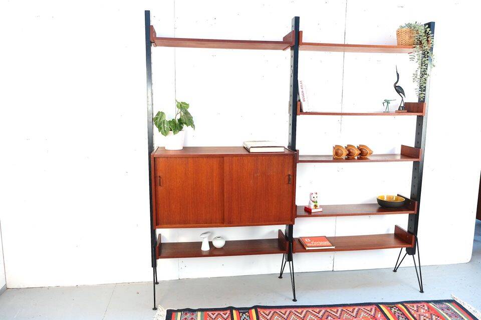 Vintage teak shelving system in 60s-70s style, retro style.
