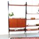 Vintage teak shelving system in 60s-70s style, retro style.