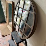 Round mirror mounted in mild steel