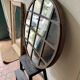 Miroir rond monté dans du fer doux