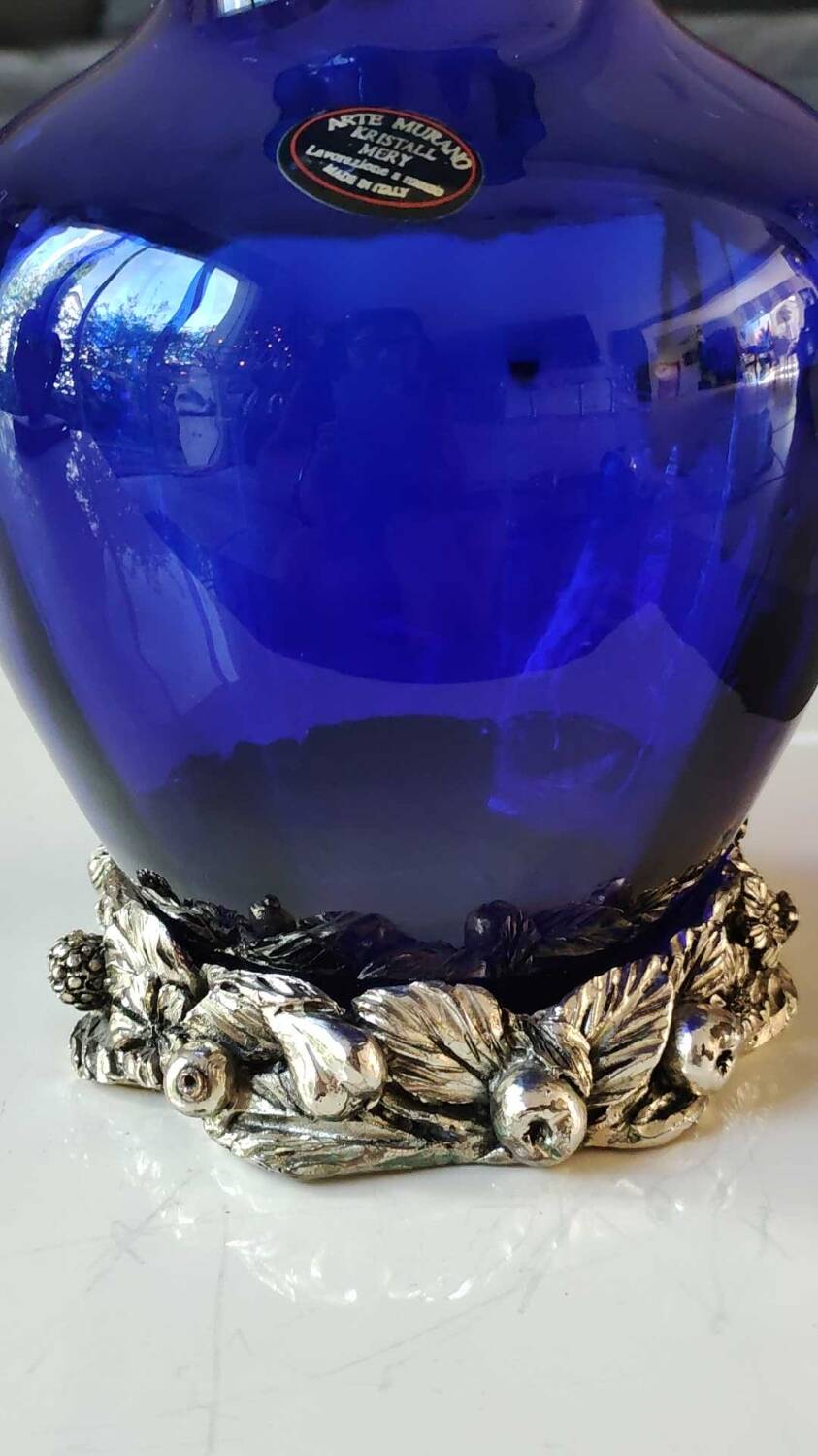 Corolle shaped vase in blown Art glass/Arte Murano Kristall Mery. Cobalt blue on a silver metal-look floral base. Dim 26 x 14 cm