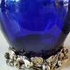 Corolle shaped vase in blown Art glass/Arte Murano Kristall Mery. Cobalt blue on a silver metal-look floral base. Dim 26 x 14 cm