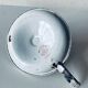 Antique enamelled metal candle holder