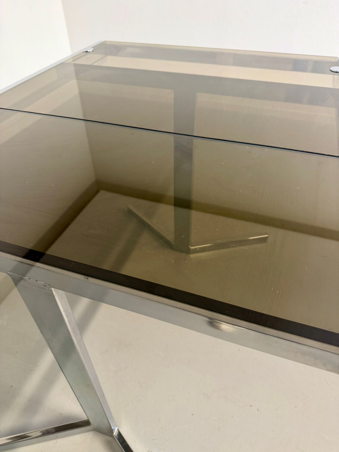 Smoked glass dining table with chrome legs, 1970s design by Roche Bobois.